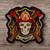 Skull in a Fireman's Helmet Against a Background of fire