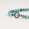 COAI Pulsera de piedra con abalorio de mal de ojo,
