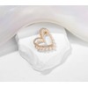 Broche de corazón con diamantes de imitación de oro con