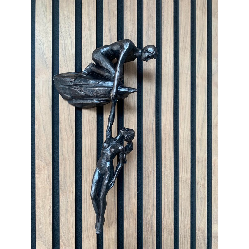 Haute Collage Man on cliff edge holding a hanging woman