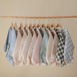 mushie Long Sleeve Baby Bib | Water Resistant Adjustable Fit for Ages 6-24 Months (Retro Stripes)