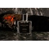 A burning bonfire, the scent of wet firewood.Burning Teakwood /