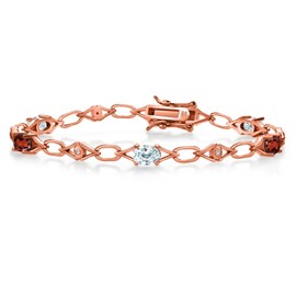 Gem Stone King 18K Rose Gold Plated Silver Sky Blue Aquamarine and Red Garnet and Round White Lab Grown Diamond Tennis Bracelet For Women (3.25 Cttw, Gemstone Birthstone, Oval 6X4MM, 7.25 Inches)