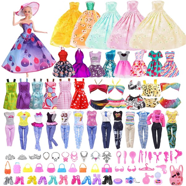 FCXQG 63 Pieces Doll Accessories Barby Clothes and Accessories Clothes Dolls Accessories Dolls Clothes Barby Dolls 14 Outfits 3 Necklaces 1 Folder 10 Shoes 18 Accessories 4 Bags 10 Hangers 3 Crowns