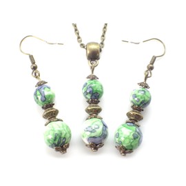 Bronze necklace and earrings set with pendant in green and black tinted white jade beads and Tibetan beads