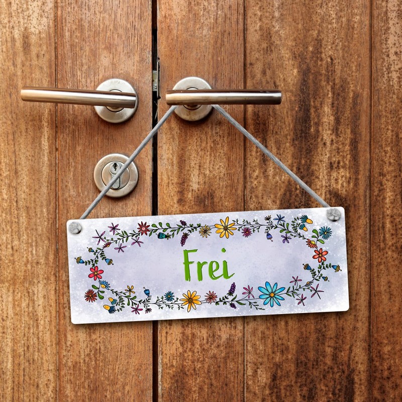 Grey toilet is free or occupied reversible sign with flower