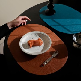 Welan PU Leather Oval Placemats Set of 4, Washable Easy Clean Heat Resistant for Dining Table Kitchen Decor (Brown)