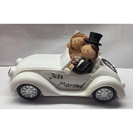 Beautiful piggy bank, money box, wedding couple in convertible