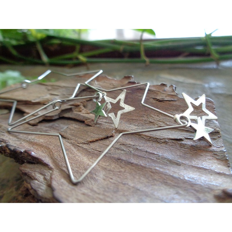 Delicate star hoop earrings made of stainless steel. Star-shaped large