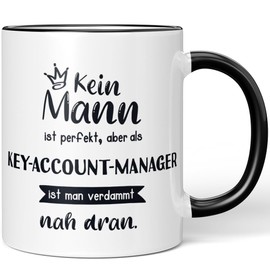 JUNIWORDS Tasse, Kein Mann ist perfekt, aber als Key-Account-Manager ist man verdammt nah dran, Schwarz (6355724)