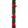 2.7M x 10cm approx Green Tinsel with Red Bows