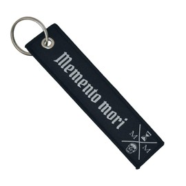 Gemelolandia | Double-sided fabric key chain Reflects Stoic Philosophy: Embroidered key chain 'Memento Mori' 13x3 cm English phrase