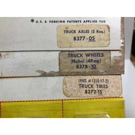 AURORA ~ T-JET ~ NOS Truck parts New on card 4 Knobby tire, 4 Wheel hubs, 2 Axle