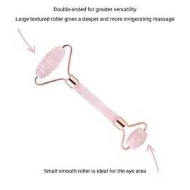 Rose quartz face roller with rose gold metal, featuring a bumpy roller and small eye roller. Double ended roller for the face.