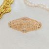 Elegant Gold - toned Oval Shaped Filigree Brooch with Crystal