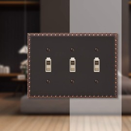 Amerelle Egg & Dart Triple Toggle Cast Metal Wallplate in Aged Bronze