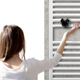 Ceramic hanger for towel warmer and radiator in the shape of a black heart handmade in Italy by Letshelter.