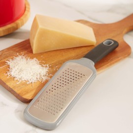 RSVP International Paddle Grater, Etched Steel Blades, Stainless Steel Hand Held Kitchen Cheese & Vegetable Shredder Comfort Grip Handle and Anti-Slip Foot and Safety Cover, Course