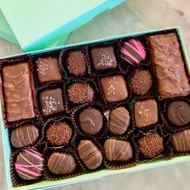 1 lb of gourmet assorted chocolate candies. A milk and dark chocolate fancy candy gift box of english toffee, chocolate covered cherries, soft center creams, and sea salt caramel chews