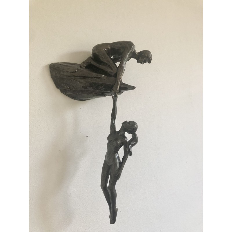 Haute Collage Man on cliff edge holding a hanging woman