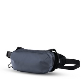 WANDRD D1 Fanny Pack – Bolsa de transporte cruzada para senderismo, viajes, festivales, deportes y más – Resistente a la intemperie para teléfonos, carteras, llaves y cámara, azul, (Agean Blue)