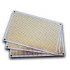 Double sided perforated grid board with round pads.