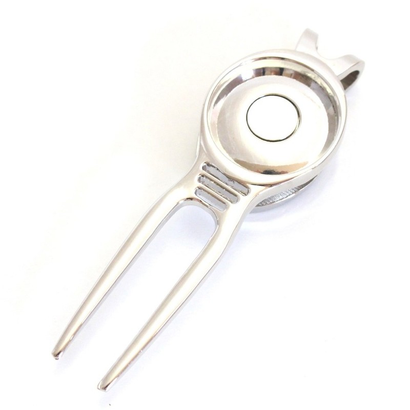 divot tool white golf ball white golf ball green fork