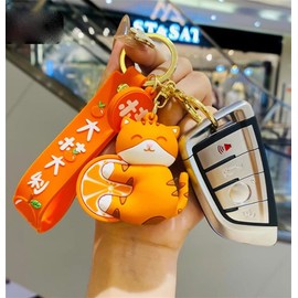 Oikabio Key Chain, With an orange cat holding an orange,Cute PVC Cartoon Key Chain,Key Chain Accessories for the bag,Easy to carry key chain for Car,Gift for someone who loves cats,Lovers,Kids
