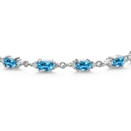 Gem Stone King 925 Sterling Silver Swiss Blue Topaz and White Moissanite Tennis Bracelet For Women (7.51 Cttw, Gemstone Birthstone, Oval 6X4MM, 6.5, 7, 7.5 Inch)
