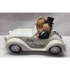 Beautiful piggy bank, money box, wedding couple in convertible