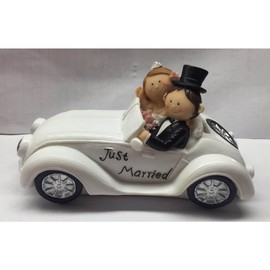 Beautiful piggy bank, money box, wedding couple in convertible