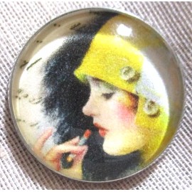 GLASS DOME PIC BUTTON LADY IN YELLOW BUCKET RAIN HAT APPLYING LIPSTICK    1 INCH