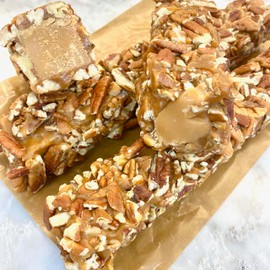Pecan Rolls Candy Collection. 1 lb of Roasted Pecans surround Praline and Caramel in a Pecan Log. A Gourmet Southern Treat. 2 Pack, 8 oz Logs