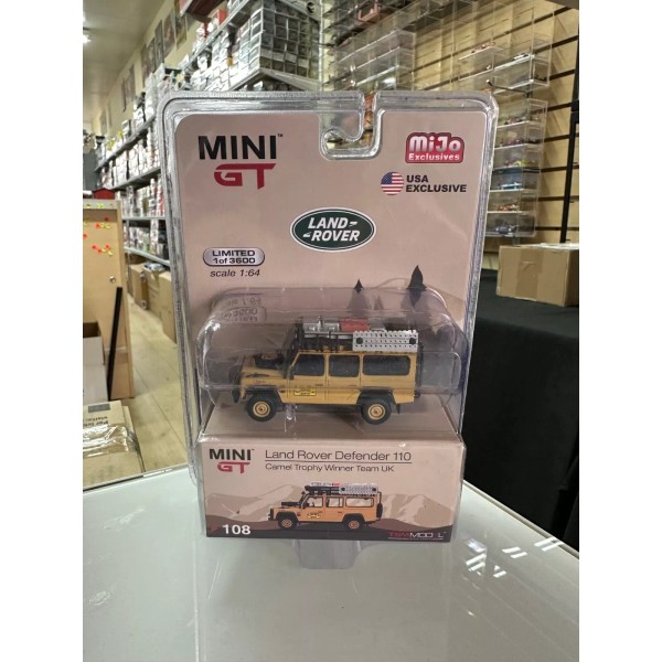 MINI GT LAND ROVER DEFENDER 110 CAMEL TROPHY WINNER TEAM