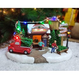 MOMENTS IN TIME Christmas Village Building, 6.7”H Polyresin Christmas Tree Lot with LED Lightup & Music - Battery Operated (not Included)