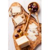 Olive wood chopping board with natural edge, 30cm