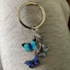 Meimimix Llavero de mariposa esmaltada con borla para mujeres y