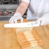 Mercer Culinary Millennia 10" Wide Bread Knife with White Handle