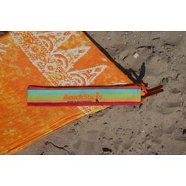 Beachsticks Rainbow wood sticks which hold your beach towel tightly and securely to the sand even in case of wind