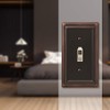 Amerelle Continental Single Toggle Cast Metal Wallplate in Aged Bronze