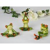 Decorative frog figure sitting in yoga posture, 1 of 3