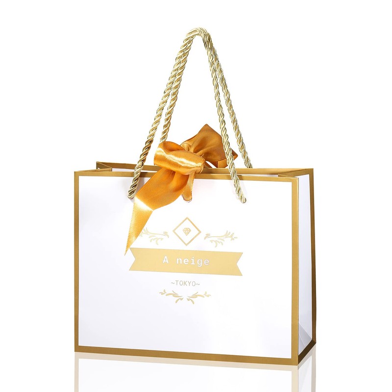 A neige Gift Bag with Gold Ribbon