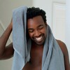 Dove Men+Care Dual Sided Shower Tool for building lather and