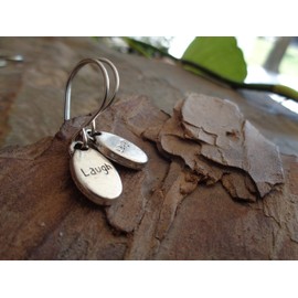 Laughing silver oval thick plates on long self-curved hooks