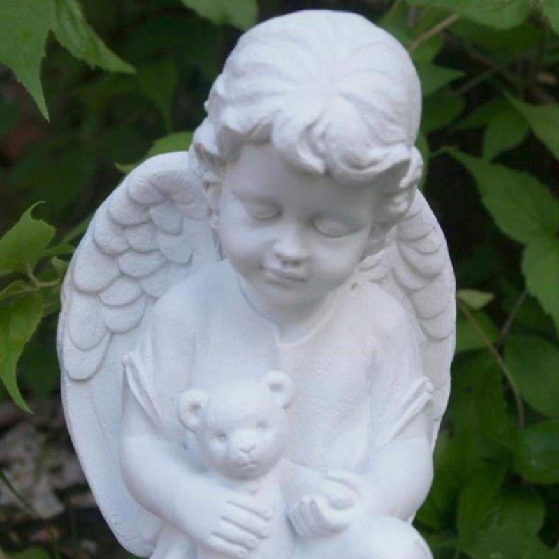 Little Angel with Consolation Teddy Holding in Arms.