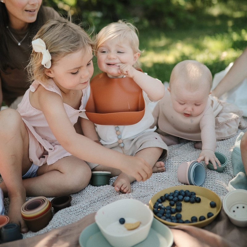 mushie Silicone Baby Bib | Adjustable Fit Waterproof Bibs (Powder