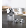 The magnetic metal puzzle pieces become a 3D puzzle that