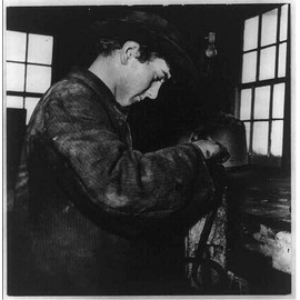 HistoricalFindings Photo: Amish boy Mending a Harness on his Family's Farm in Pennsylvania 1943