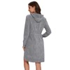 Mnamo Elegant women's bathrobe with hood and zip, made of