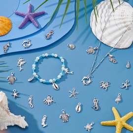 UNICRAFTALE 100Pcs 20 Styles Assorted Ocean Charms Set Seashells Starfish Conch Dolphin Pendant Set Tibetan Style Pendants Antique Silver Ocean Life Seafish Charms for DIY Jewelry Making